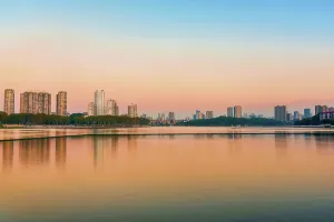 Jiujiang Prints: Cityscape of Jiujiang City at sunset over the Sai Lake, Jiangxi Province, China
