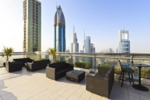 Chairs Prints: Cityscape seen from rooftop bar, Sheikh Zayed Road, Dubai, United Arab Emirates