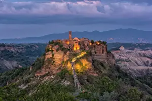 Sunburst Prints: Civita di Bagnoregio and surrounding badlands just after sunset, Lazio, Italy, Europe