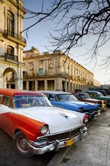 Classic American cars used as taxis for local people, parked outside the main railway station
