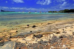 Watercraft Prints: Clear water and boats near rocky shore in Cap Malheureux
