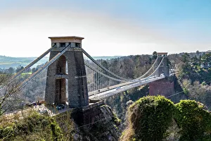Pedestrians Prints: Clifton Suspension Bridge with towers against a clear sky