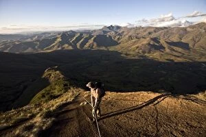 A climber descending a long granite ridge from the upper Tsaranoro Massif
