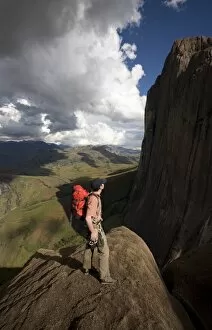 A climber looks up towards the 800 metre Tsaranoro Be (Big Tsaranoro) Monolith