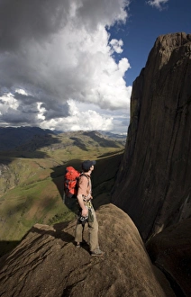 Images Dated 11th April 2008: A climber looks up towards the 800 metre Tsaranoro Be (Big Tsaranoro) Monolith