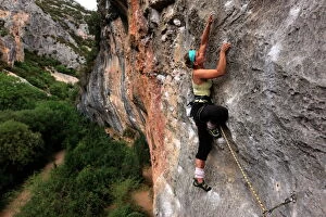 Images Dated 17th September 2009: Climber makes her way up one of the rock faces of the celebrated Mascun Gorge