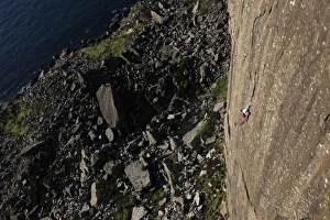 Strength Prints: A climber scales the 100 metre cliffs at Fair Head