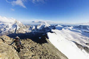 Rock Climbing Prints: Climber on south ridge of Dent Blanche, 4357m, with view to the Matterhorn, Valais