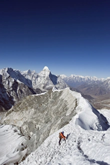 Climber on summit ridge of Island Peak, 6189m, Ama Dablam, 6812m, Solu Khumbu Everest Region