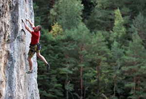 Images Dated 12th October 2009: A climber tackles a steep route on limestone cliffs near the mountain town of Bielsa