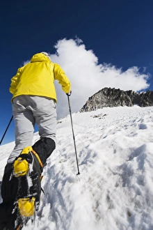 Images Dated 21st August 2010: A climber walking up a snowfield, Pico de Aneto, the highest peak in the Pyrenees