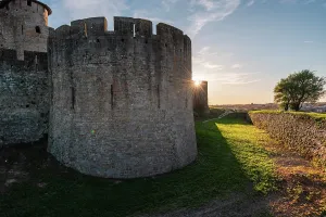Carcassonne Prints: Close up of the corner wall tower with sun rays behind it