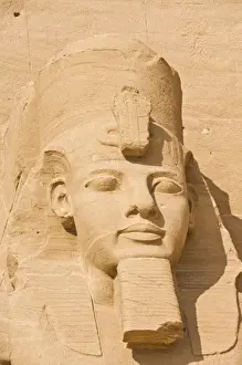 Abu Simbel Prints: Close up of the head of a giant statue of the great pharaoh Rameses II outside the relocated Temple Rameses II at Abu