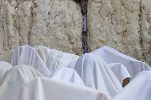 Obscured Face Prints: Close up of men covered with white prayer shawls receiving