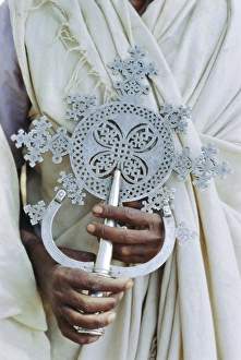 Gondar Prints: Close up of priest holding cross, Church of Narga Selassie, Lake Tana, Gondar