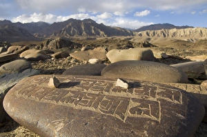 Close up of traditional carved prayer stones on a prayer