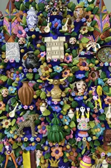 Stereotypically Mexican Prints: Close up of a traditional Tree of Life, a themed clay sculpture typical to central Mexico