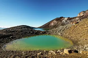 Crater Prints: Close up of turquoise, vibrant Emerald Lake with steaming volcano on Tongariro Crossing
