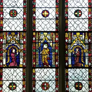 Chapels Prints: Close-up of 13th and 14th century stained glass windows of saint with kneeling patrons