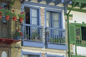 Euskadi Prints: Close-up of balconies and windows painted blue and green