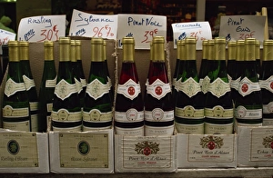 Close-up of bottles of white and rose wine on sale, France, Europe