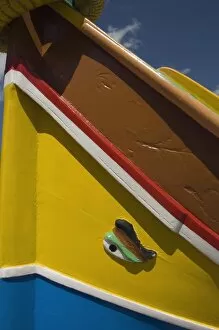 Close-up of a brightly coloured fishing boat (Luzzus) with the eye of Osiris to ward off evil at Marsaxlokk