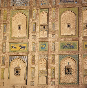 Lahore Prints: Close-up of decorative tiles on a brick building in Lahore