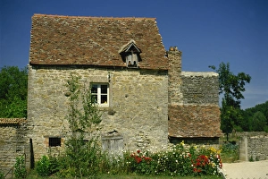 Bourgogne Prints: Close-up of exterior of a stone house, with cracked walls, and a flower bed