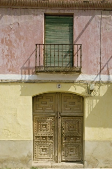 New Castile Prints: Close-up of exterior of a wooden door and small balcony