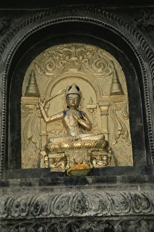 Inspiring Prints: Close-up of gold relief carving of Manjushri