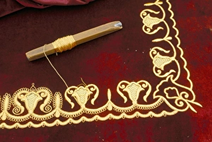 Achaemenid Prints: Close-up of gold work embroidery