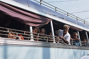 Buses Prints: Close-up of a group of Indian people on a bus