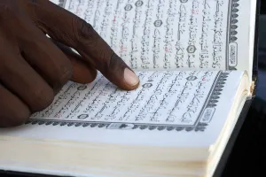 Quran Prints: Close-up of hands of African Muslim man reading the Quran, Togo, West Africa, Africa