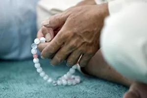 Closeup View Gallery: Close-up of man praying in a mosque with Tasbih (prayer beads), Masjid Al Rahim Mosque