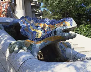 Close-up of a mosaic dragon statue in the Guell Park of Gaudi architecture