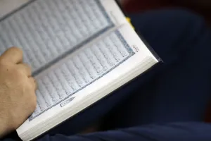Hanoi Prints: Close-up of Muslim man reading the Noble Quran, Hanoi, Vietnam, Indochina, Southeast Asia