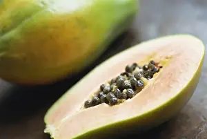Healthy Eating Prints: Close-up of a papaya sliced in half showing black seeds inside