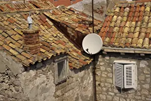 Satellite Dishes Prints: Close-up of roof tiles, old stone walls and satellite dish in the old town of Dubrovnik
