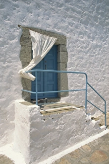 Patmos Prints: Close-up of stairs with blue rail and door of a whitewashed