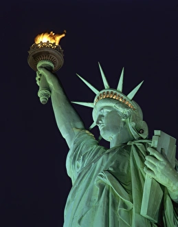 Close-up of the Statue of Liberty illuminated at night, in New York Close-up of the Statue of Liberty illuminated at night, in New York