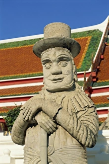 Guard Prints: Close-up of a stone statue of a Farang guard