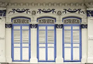 Shutters Prints: Close-up of traditional old houses with shuttered windows and decorative mouldings in Little India