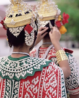 Bare Foot Prints: Close-up of the back view of two dancers in traditional