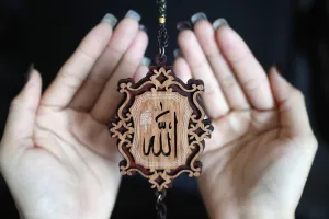 25 29 Years Prints: Close-up of the word Allah in Arabic calligraphy and woman praying, Vietnam, Indochina