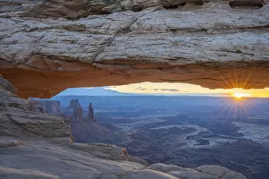 Close up view of canyon through Mesa Arch at sunrise, Canyonlands National Park, Utah