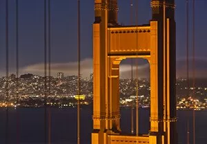 Images Dated 16th September 2009: Closeup view of the north tower of the Golden Gate Bridge at sunset with the San Francisco city