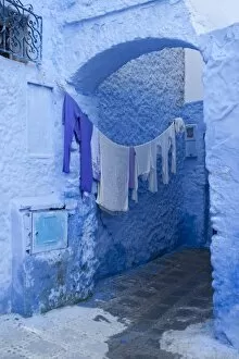 Images Dated 14th November 2009: Clothes drying in a typical house entrance, Chefchaouen, Morocco, North Africa, Africa
