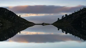 Silhouetted Gallery: Clouds over Brenta Dolomites and Lake Ritorto at sunset, Madonna di Campiglio