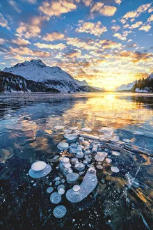 Engadine Prints: Clouds in the burning sky at sunset on Piz Da La Margna