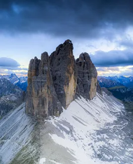 Clouds over the majestic peaks of Tre Cime di Lavaredo, aerial view